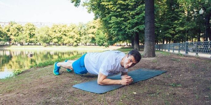 man doing planks to lose weight